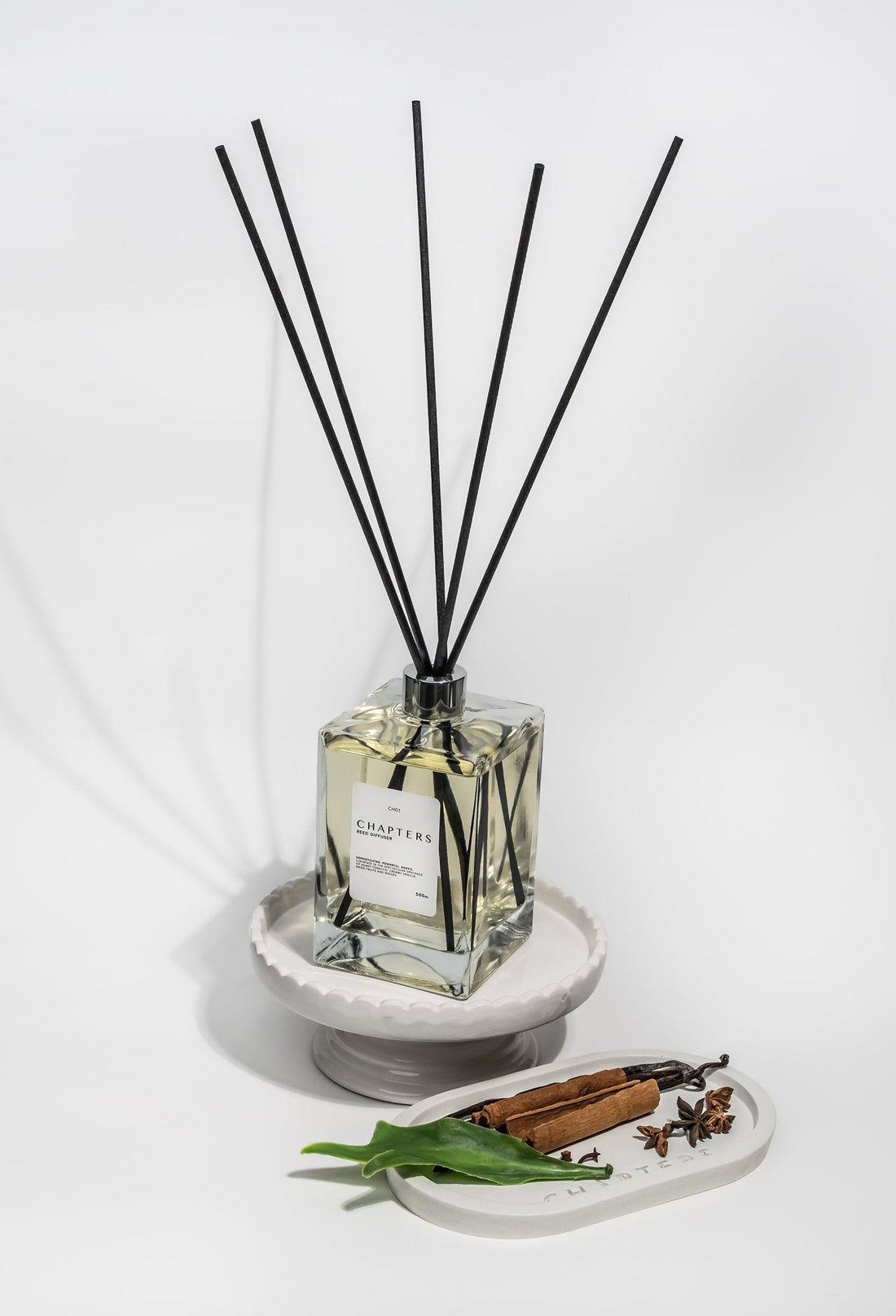 CH01 Deluxe Reed Diffuser with black reeds and spicy amber tones
