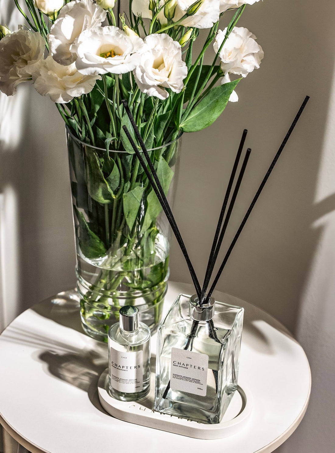 CH03 Deluxe Reed Diffuser with black reeds and floral decor on white background